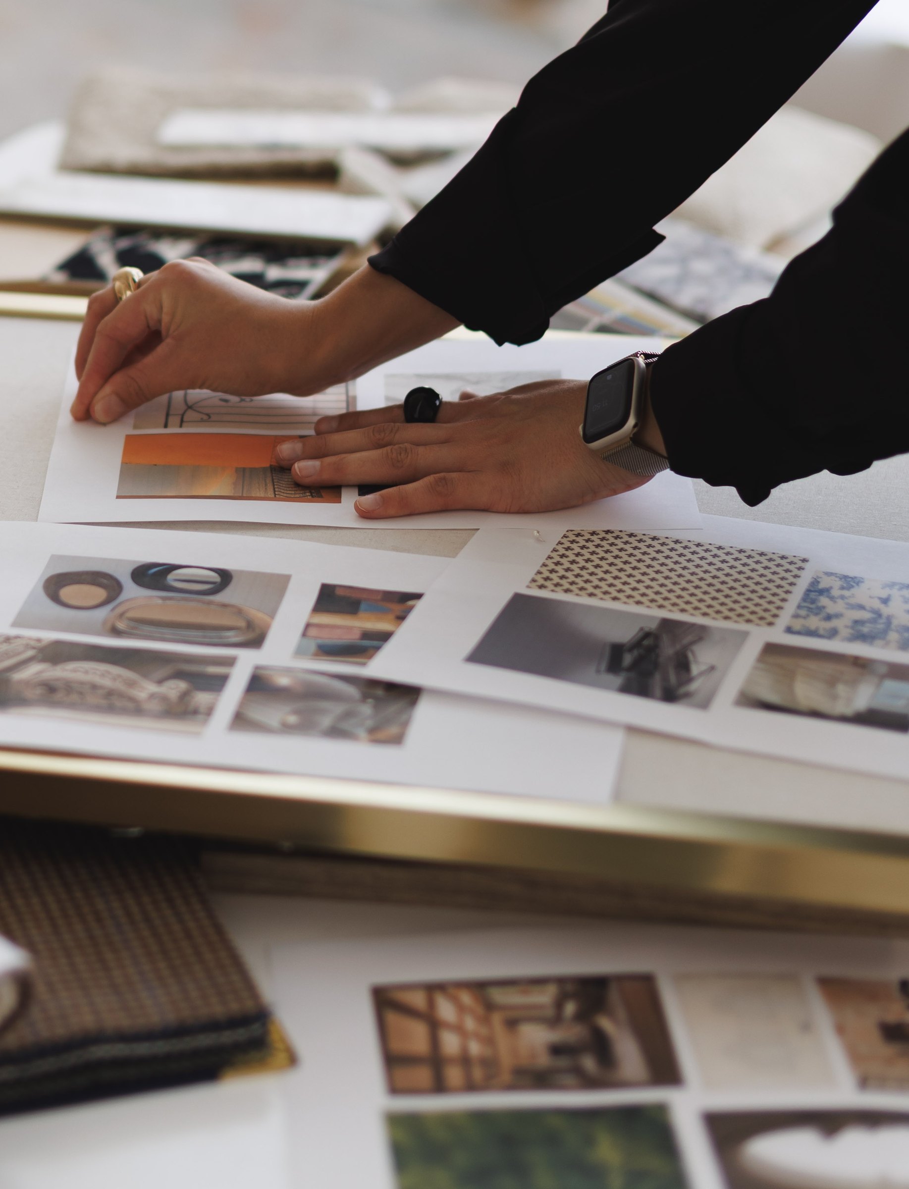 Karina pinning reference images onto a framed mood board